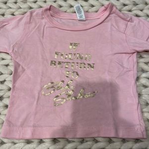 T shirt size says 6-12mn